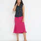 Model wearing Coastline Bias Skirt Magenta European flax linen bias cut midi skirt made in Canada