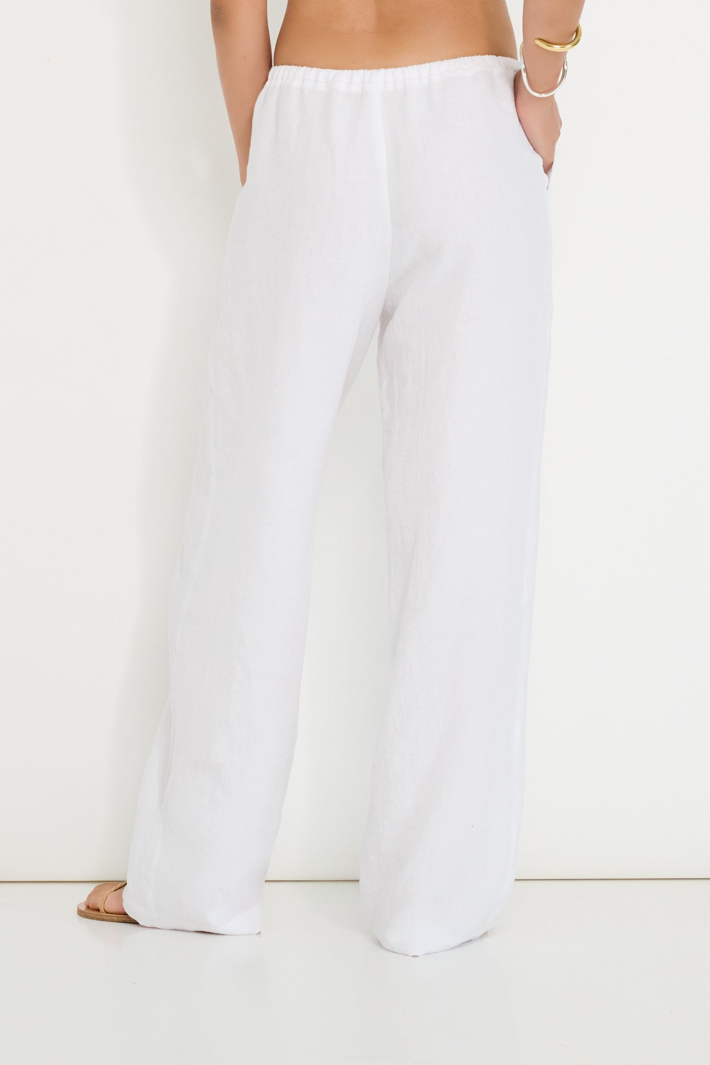 Coastline Pants in ivory linen with elastic waistband, back view of straight-leg summer pants made in Canada