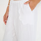 Coastline Pants in ivory linen with scalloped pocket detail and elastic waistband, made in Canada
