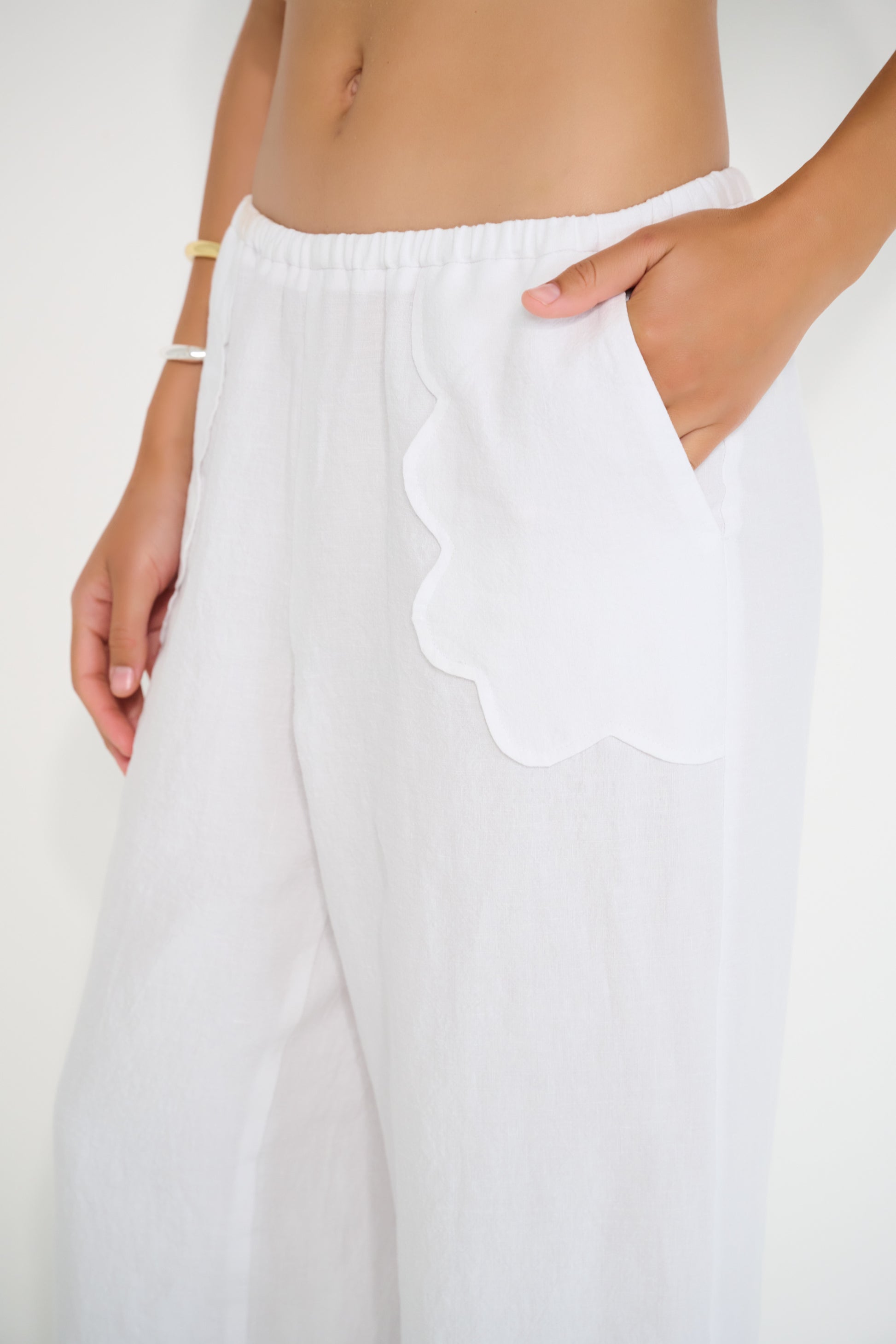 Coastline Pants in ivory linen with scalloped pocket detail and elastic waistband, made in Canada