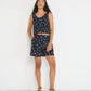 Model wearing Reef Reversible Top Petit Surfer print French cotton seersucker reversible top with Reef Shorts made in Canada