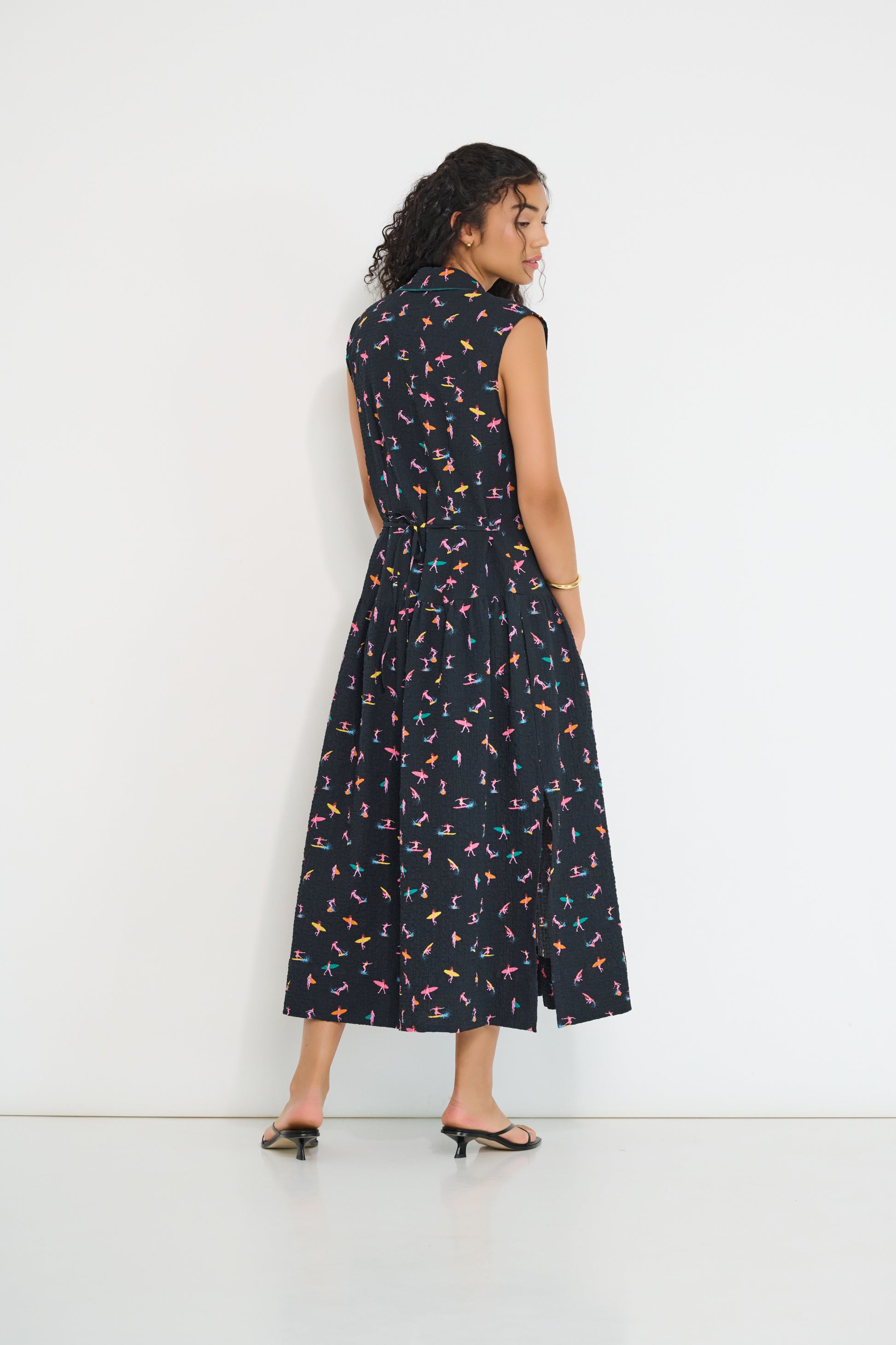 Reverie midi dress back view in black Petit Surfer French cotton seersucker with drop waist silhouette and spaghetti belt made in Canada