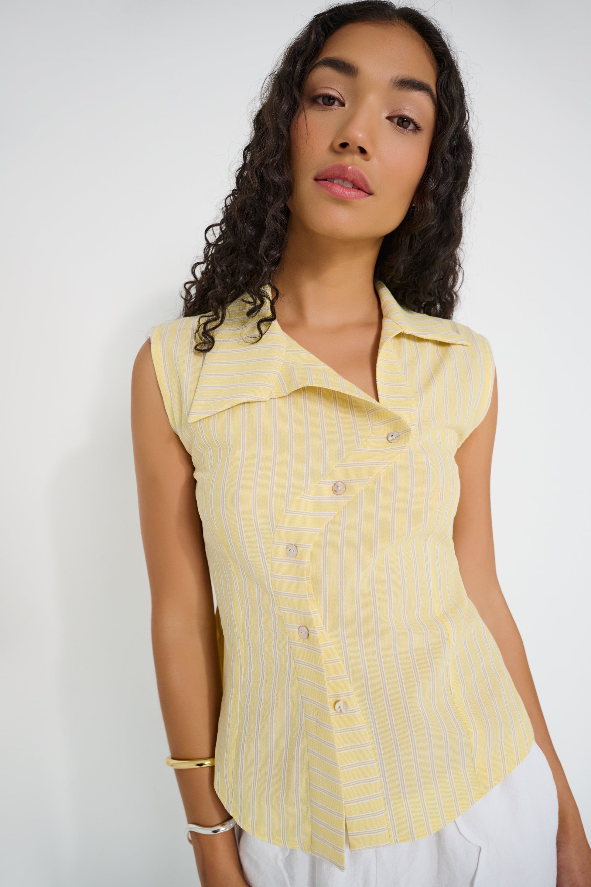 Reverie Vest in sunbeam stripe Japanese cotton with asymmetrical button front and tailored fit, made in Canada