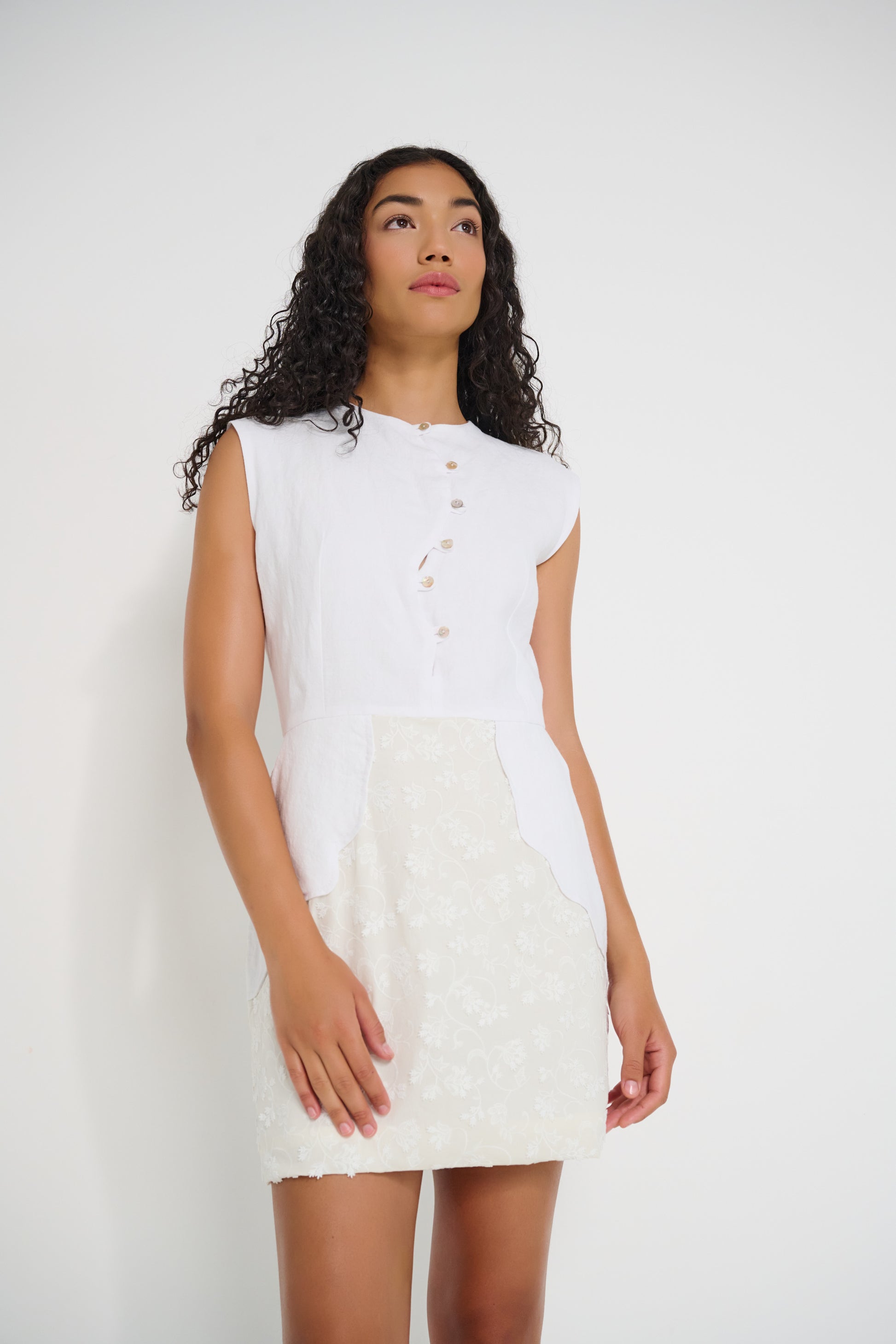 Stellaire Dress in white linen with sleeveless silhouette and button front detail, made in Canada