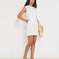 Stellaire Dress in white linen with ivory lace detail and shell buttons, made in Canada