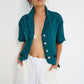 Stellaire Shorts in white linen with ivory lace patch pockets styled for summer, made in Montreal