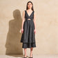 Twisted Basics dress in black Japanese twill with bow appliqué skirt and flattering twisted bodice – Made in Canada