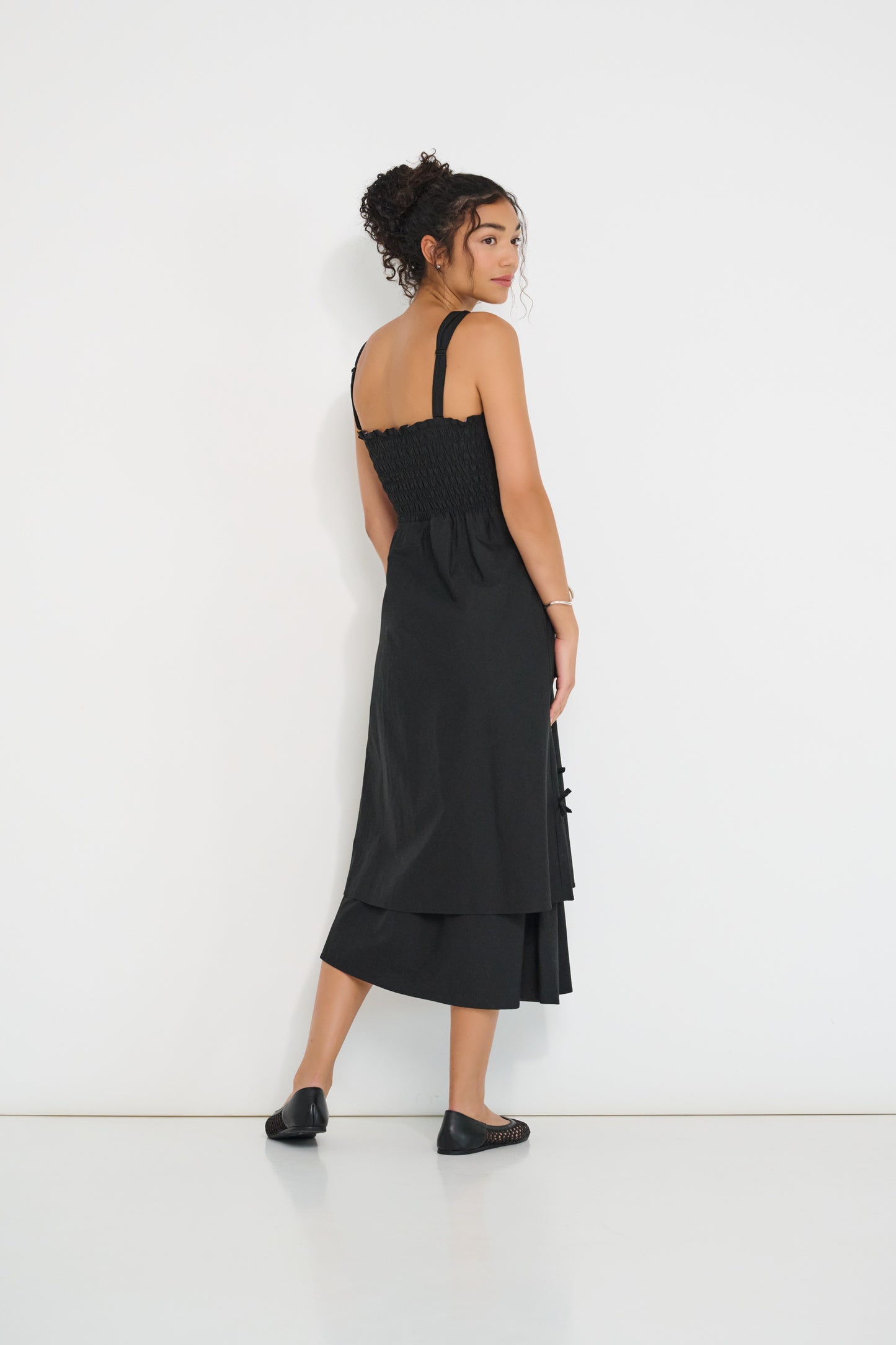 Twisted Basics dress in black Japanese twill back view with shirred back bodice and full skirt – Made in Canada
