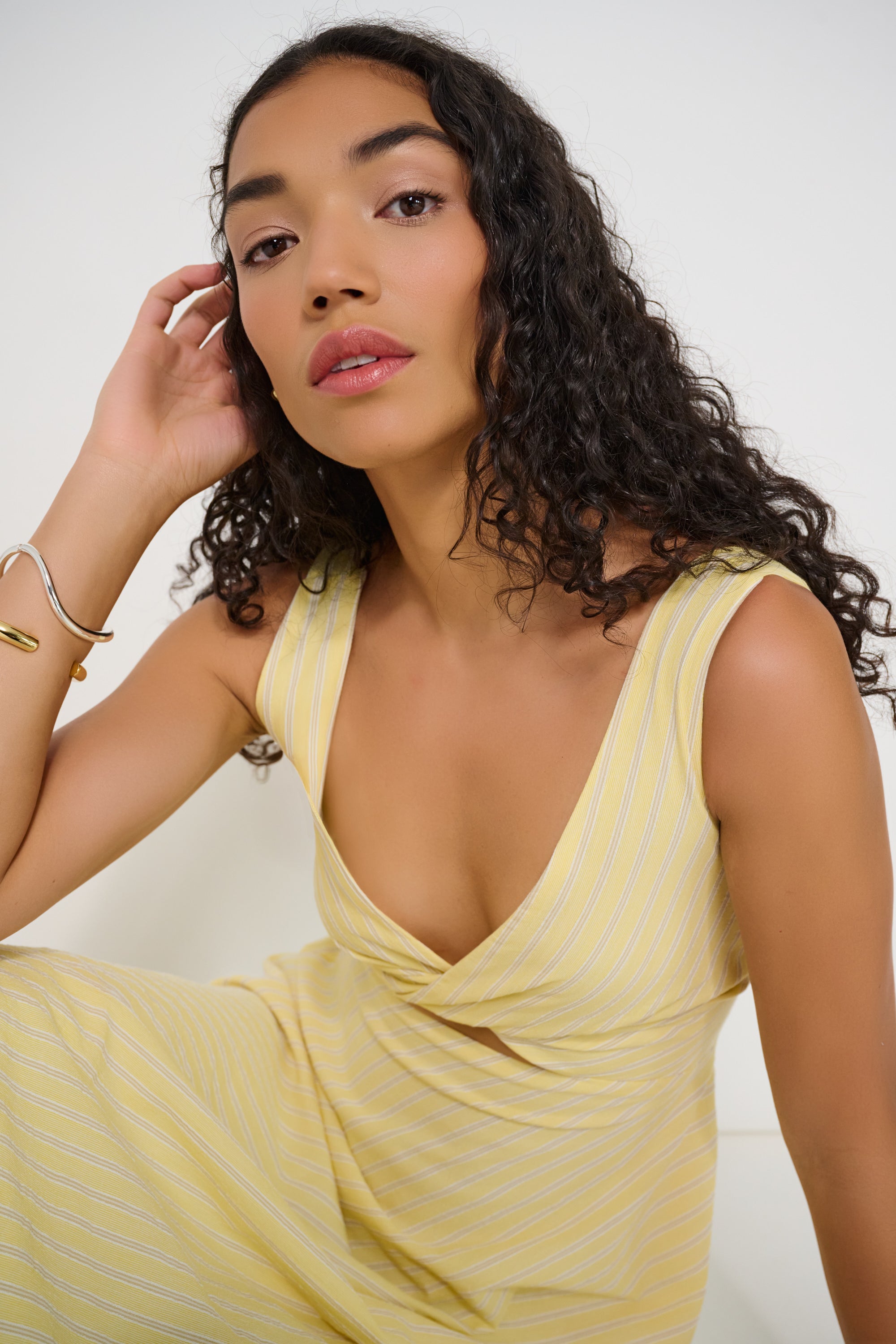 Close-up of twisted neckline on Ultimate Summer Dress in butter yellow striped Japanese cotton, made in Canada