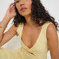 Close-up of twisted neckline on Ultimate Summer Dress in butter yellow striped Japanese cotton, made in Canada