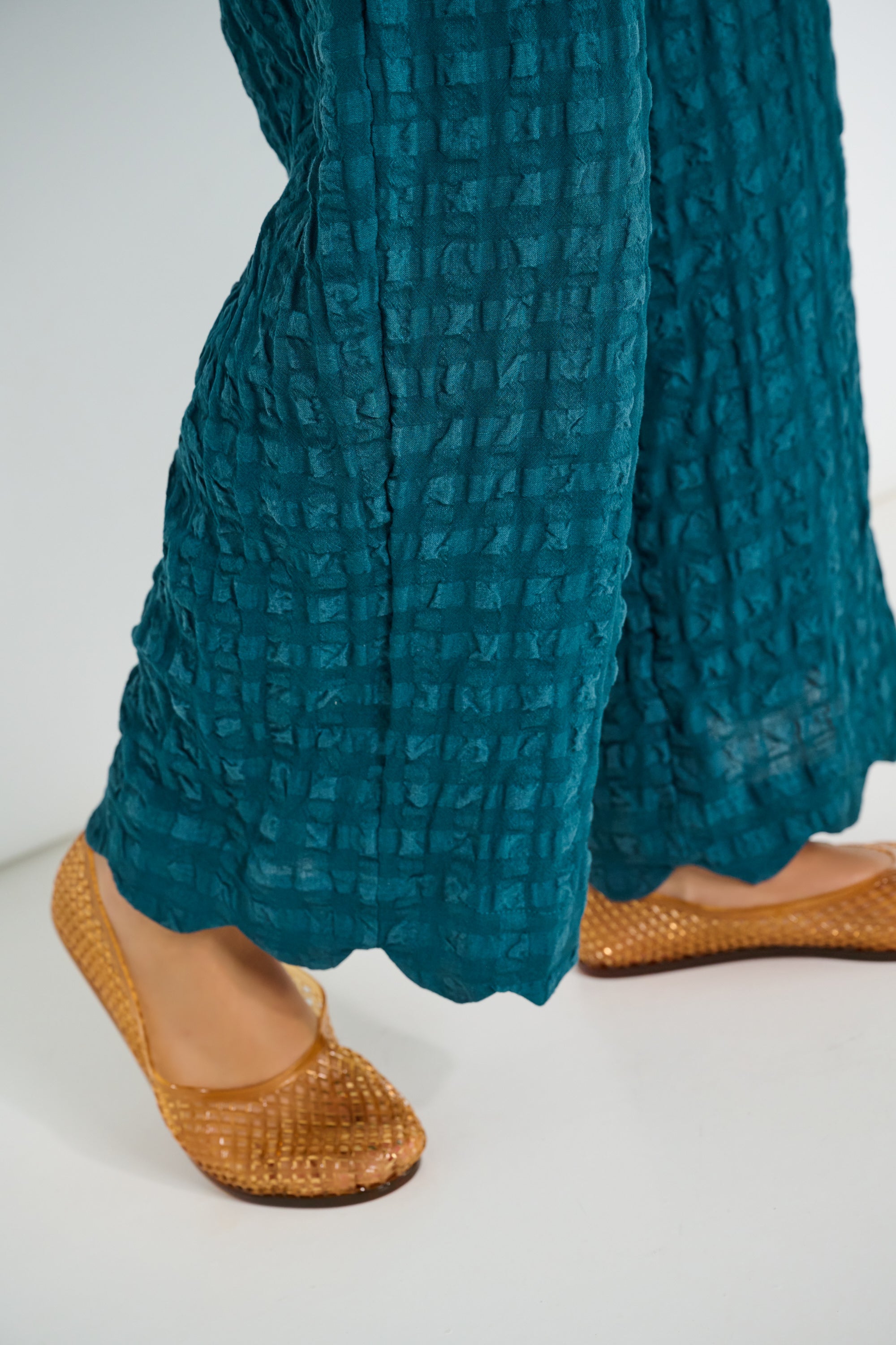 Voyage Pants deep teal seersucker fabric detail with scalloped hem and relaxed fit