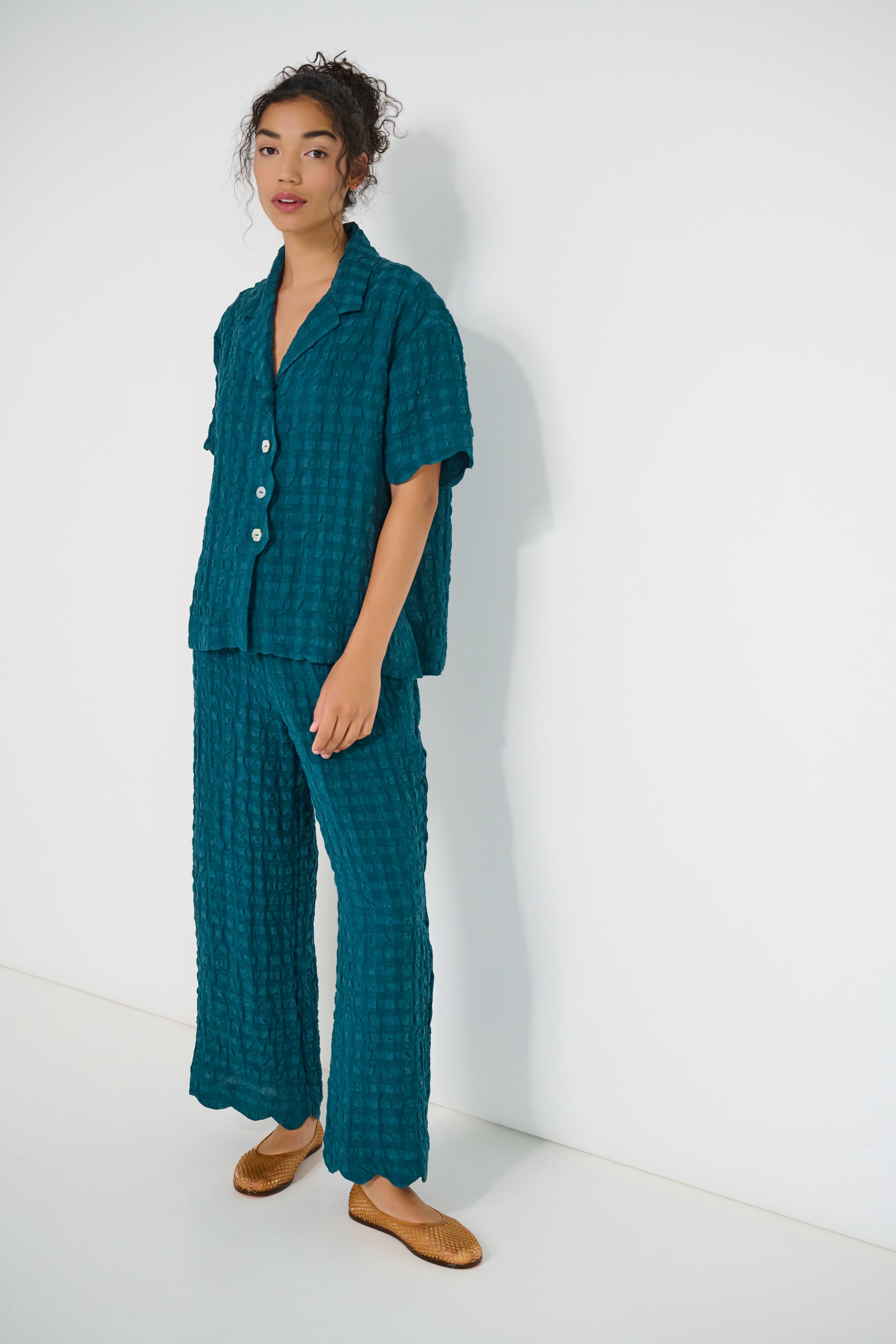 Voyage Pants in deep teal linen-viscose seersucker with scalloped hem, lightweight breathable fabric, made in Canada