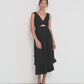 Twisted Basics dress in black Japanese twill on model showing movement of layered skirt and twisted bodice – Made in Canada